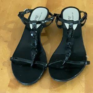 Low heeled black sandals with decorative straps